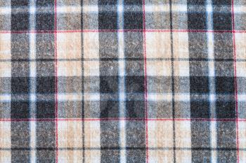 textile background - plaid twilled cotton fabric close up