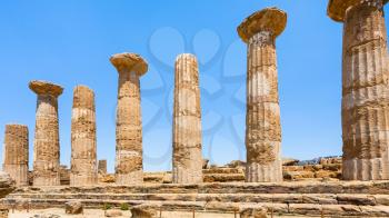 travel to Italy - Dorian columns of ancient Temple of Heracles (Tempio di eracle) in Valley of the Temples in Agrigento, Sicily