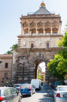 PALERMO, ITALY - JUNE, 24, 2011: view of Porta Nuova from via Corso Calatafimi in Palermo city. Porta Nuova is magnificent gateway built in 1535 in honor of Emperor Charles V victory at Tunis