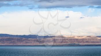 Travel to Middle East country Kingdom of Jordan - view of Dead Sea and Jerusalem city in Israel coast from Jordan shore in winter morning