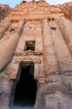 Travel to Middle East country Kingdom of Jordan - entrance in Royal Urn Tomb in ancient Petra town