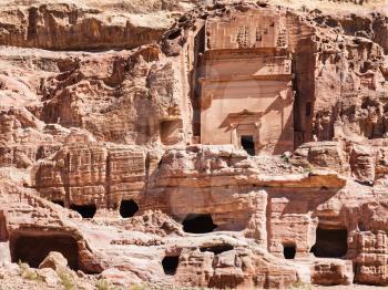 Travel to Middle East country Kingdom of Jordan - front view of Uneishu Tomb in ancient Petra city in winter