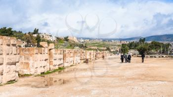 JERASH, JORDAN - FEBRUARY 18, 2012: people near wall of circus hippodrome in Gerasa. Greco-Roman town Gerasa (Antioch on the Golden River) was founded by Alexander the Great or his general Perdiccas
