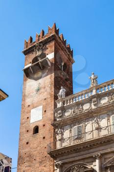travel to Italy - view of tower Torre del Gardello near Palazzo Maffei on Piazza delle Erbe (Market's square) Verona city in spring