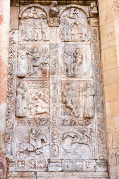 travel to Italy - medieval outdoor bas-relief on gate of Basilica di San Zeno ( San Zeno Maggiore, San Zenone) in Verona city