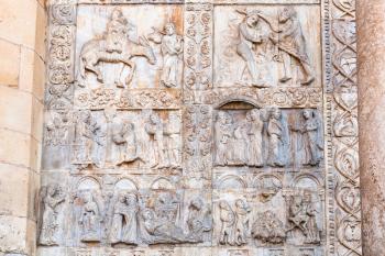 travel to Italy - medieval outdoor bas-relief of portal of Basilica di San Zeno ( San Zeno Maggiore, San Zenone) in Verona city
