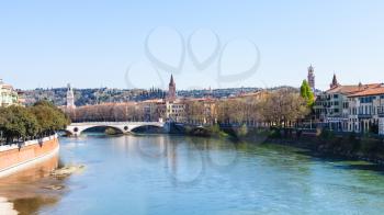 travel to Italy - view of Adige river with Ponte della vittoria in Verona city in spring