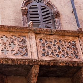 travel to Italy - medieval decoraion of old urban house in Verona city in spring