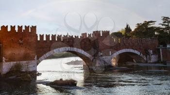 travel to Italy - view of Castelvecchio (Scaliger) Bridge on Adige River in Verona city in spring evening
