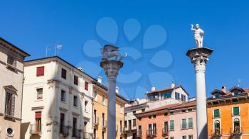 travel to Italy - statues on tops of columns at Piazza dei Signori in Vicenza city in spring