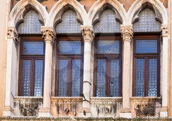 travel to Italy - window of medieval palazzo thiene on street contra porti in Vicenza city in spring.