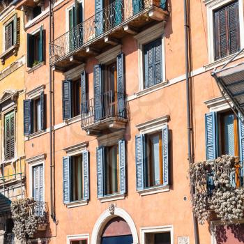 travel to Italy - facade of old apartment houses on street Stradone San Fermo in Verona city in spring