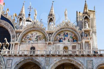 travel to Italy - decorated facade of St Mark's Basilica on Piazza San Marco in Venice city in spring day