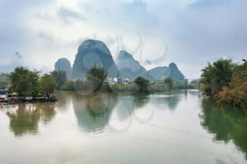 travel to China - calm surface Yulong and Jinbao river and karst peaks in Yangshuo County in spring season