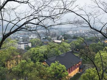 travel to China - above view of green urban park and Guilin city in spring season