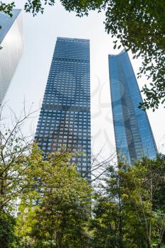 GUANGZHOU, CHINA - APRIL 1, 2017: view of high-rise buildings from park in Zhujiang New Town of Guangzhou in spring. Guangzhou is the third most-populous city in China with population about 13,5 mln