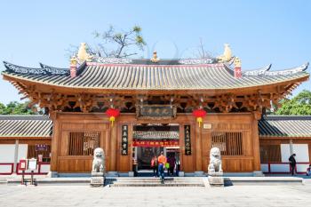 GUANGZHOU, CHINA - APRIL 1, 2017: visitors near doors of Guangxiao Temple (Bright Obedience, Bright Filial Piety Temple). This is is one of the oldest Buddhist temples in Guangzhou city
