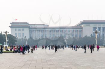 BEIJING, CHINA - MARCH 19, 2017: visitors and view of Great hall of The people on Tiananmen Square in spring. Tiananmen Square is central city square in Beijing
