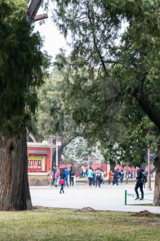 BEIJING, CHINA - MARCH 19, 2017: people in Working People's Cultural Palace (Imperial Ancestral Hall) public park in Beijing Imperial city in spring. This park is part of Forbidden City green area