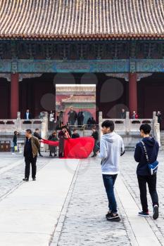 BEIJING, CHINA - MARCH 19, 2017: tourists on courtyard of Imperial Ancestral Temple (Taimiao, Working People's Cultural Palace) in Beijing Imperial city in spring. The first Hall was built in 1420