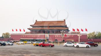BEIJING, CHINA - MARCH 19, 2017: cars on West Chang'an Avenue near The Tiananmen monument (Gate of Heavenly Peace) on Tiananmen Square in spring. Tiananmen Square is central city square in Beijing