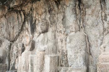 LUOYANG, CHINA - MARCH 20, 2017: carved Buddha sculpture in Longmen Grottoes (Longmen Caves). The complex was inscribed upon the UNESCO World Heritage List in 2000