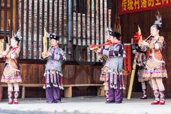 CHENGYANG, CHINA - MARCH 27, 2017: folk musician in Culture Show on square of Folk Custom Centre of Chengyang village of Sanjiang County in spring. Chengyang includes eight villages of the Dong people