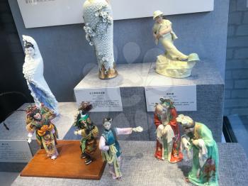GUANGZHOU, CHINA - APRIL 1, 2017: various porcelain figurines in Chen Clan Ancestral Hall (Guangdong Folk Art Museum) in Guangzhou city. The house was prepared for imperial examinations in 1894