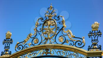 Travel to Provence, France - decoration of gate of ancient Jardins de la fontaine (Fountain Gardens) in Nimes city