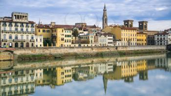 travel to Italy - panoramic view of Arno River and houses on Lungarno delle grazie in Florence city in sunny winter day