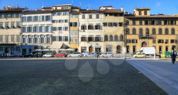 FLORENCE, ITALY - JANUARY 10, 2009: people and medieval houses on Piazza de' Pitti in Florence city in winter. Piazza dei Pitti is a large square in the Oltrarno district near Palazzo Pitti