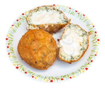 traditional sicilian street food - spinach stuffed rice balls arancini on plate isolated on white background
