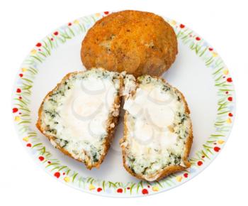 traditional sicilian street food - spinach and sauce stuffed rice balls arancini on plate isolated on white background