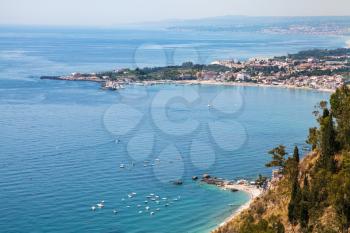 travel to Sicily, Italy - view of Giardini Naxos town on beach of Ionic sea from Belvedere viewpoint at Piazza IX Aprile in Taormina city