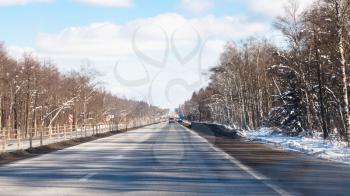 view of M1 highway (Russian route M1, Belarus Highway, European route E30) in Smolensk oblast of Russia in winter day