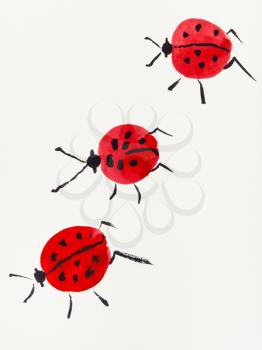 hand painting in sumi-e style on cream paper - three ladybugs drawn by red and black watercolors