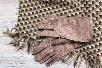 workshop on sewing gloves - top view of new hand-made sewn gloves on wool shawl
