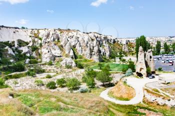 Travel to Turkey - bus stop near ancient cave monastery near Goreme town in Cappadocia in spring