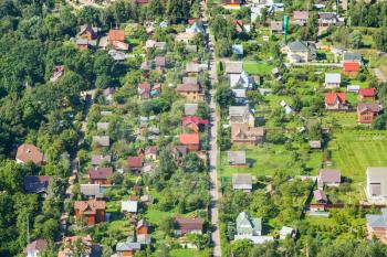 above view of cottages in village in Moscow Region in Istrinsky district in summer day