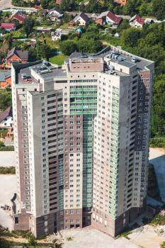above view of new high-rise apartment house in suburb of Istra town in Moscow Region in summer day