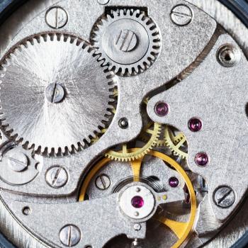 watchmaker workshop - gears of mechanical wristwatch close up