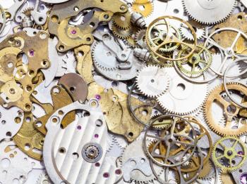watchmaker workshop - many old watch spare parts close up
