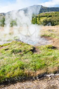 travel to Iceland - crater in Haukadalur geyser valley in autumn