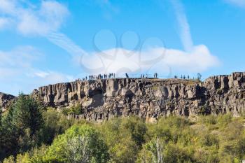 travel to Iceland - people at Observation Deck of Almannagja fault in Thingvellir national park in autumn