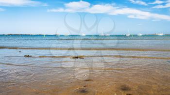 travel to France - view of on bay Anse de Launay from beach Plage de la Baie de Launay of English Channel in Paimpol region of Cotes-d'Armor department of Brittany in sunny summer day