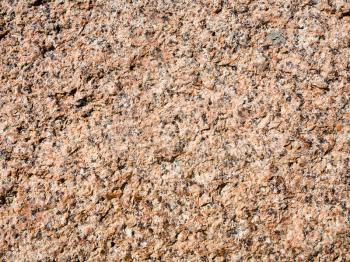 travel to France - texture of granite rock in natural park of Ploumanac'h site of Perros-Guirec commune on Pink Granite Coast of Cotes-d'Armor department of Brittany in sunny summer day