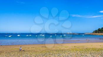 travel to France - panoramic view of beach Plage de la Baie de Launay on bay Anse de Launay of English Channel in Paimpol region of Cotes-d'Armor department of Brittany in sunny summer day