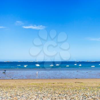 travel to France - beach Plage de la Baie de Launay on bay Anse de Launay of English Channel in Paimpol region of Cotes-d'Armor department of Brittany in sunny summer day