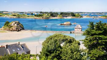 travel to France - above view of coast with tide mill Birlot in Brehat commune at Ile-de-Brehat island in Cotes-d'Armor department of Brittany in summer sunny day
