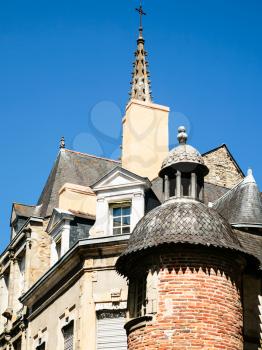 travel to France - old urban houses and tower of church Notre-Dame in Vitre town in Ille-et-Vilaine department of Brittany in sunny summer day